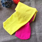 Tyttöjen pinkki-keltaiset kaksiväriset sukkahousut.